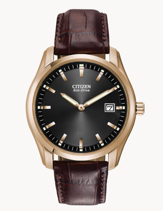  Crafted in stainless steel rose gold-tone with a black dial, luminous hands, date indicator and sophisticated brown leather strap.