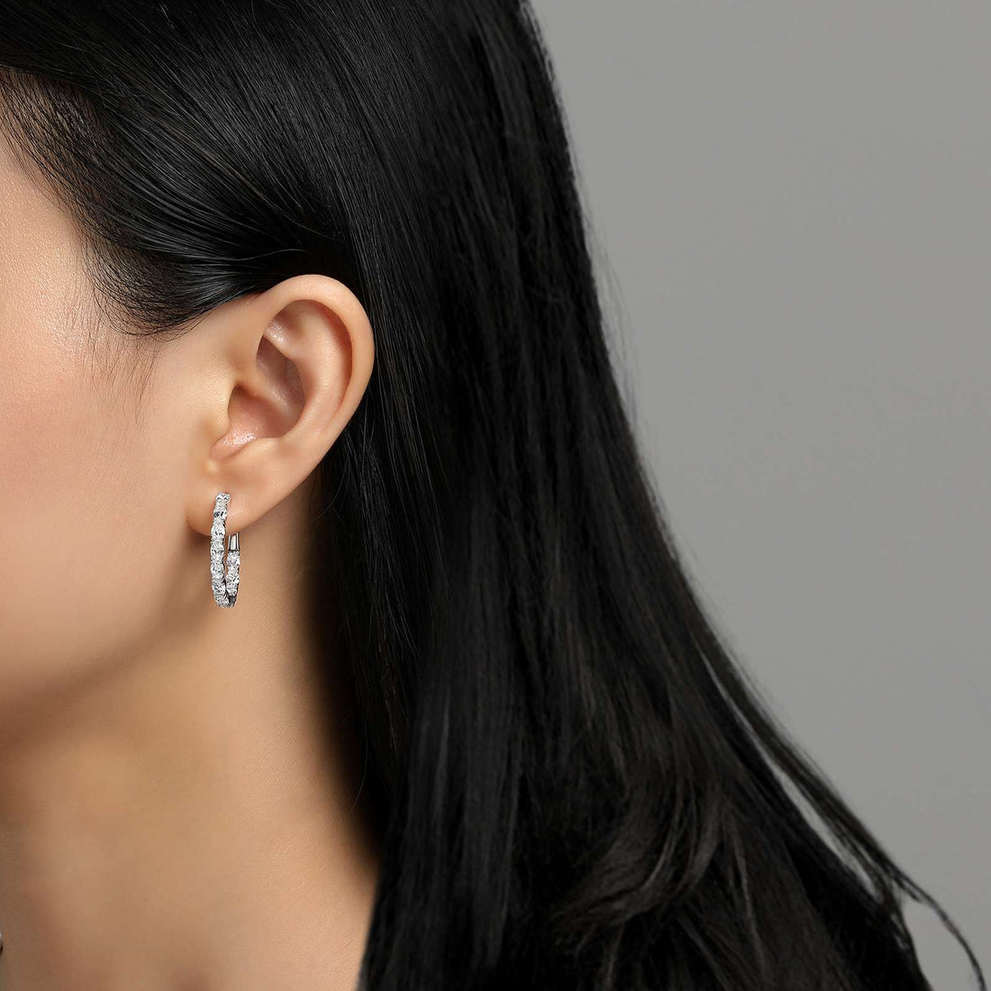 Fun and elegant. These inside out oval hoop earrings are set with Lafonn's signature Lassaire simulated diamonds in sterling silver bonded with platinum. 20 mm x 25 mm Oval.