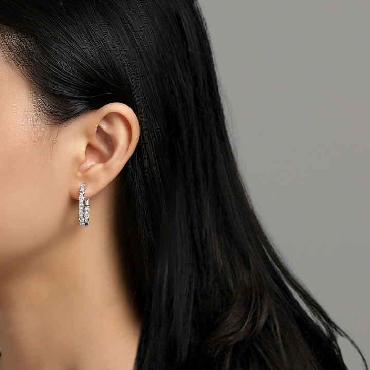 Fun and elegant. These inside out oval hoop earrings are set with Lafonn's signature Lassaire simulated diamonds in sterling silver bonded with platinum. 20 mm x 25 mm Oval.