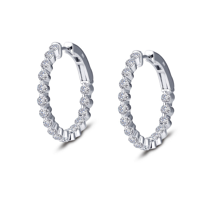 Classic hoops for every occasion. These inside out hoop earrings are set with Lafonn's signature Lassaire simulated diamonds in sterling silver bonded with platinum. 25 mm diameter.