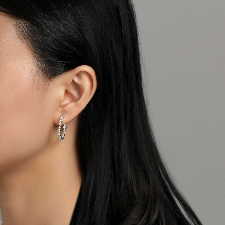 Fun and elegant. These inside out hoop earrings are set with Lafonn's signature Lassaire simulated diamonds in sterling silver bonded with platinum. 20 mm diameter