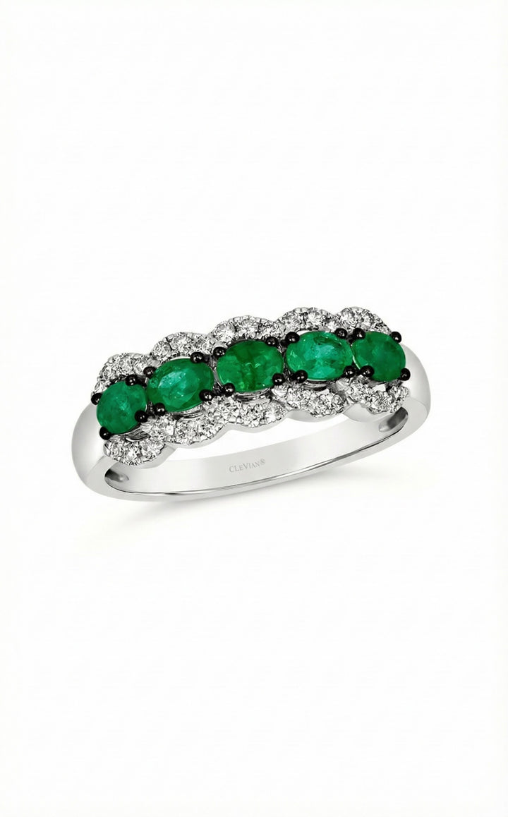 14K White Gold Oval Emerald & Diamond Halo Band This elegant band showcases a row of vivid oval-cut emeralds, each framed by sparkling round diamonds in a soft scalloped halo.