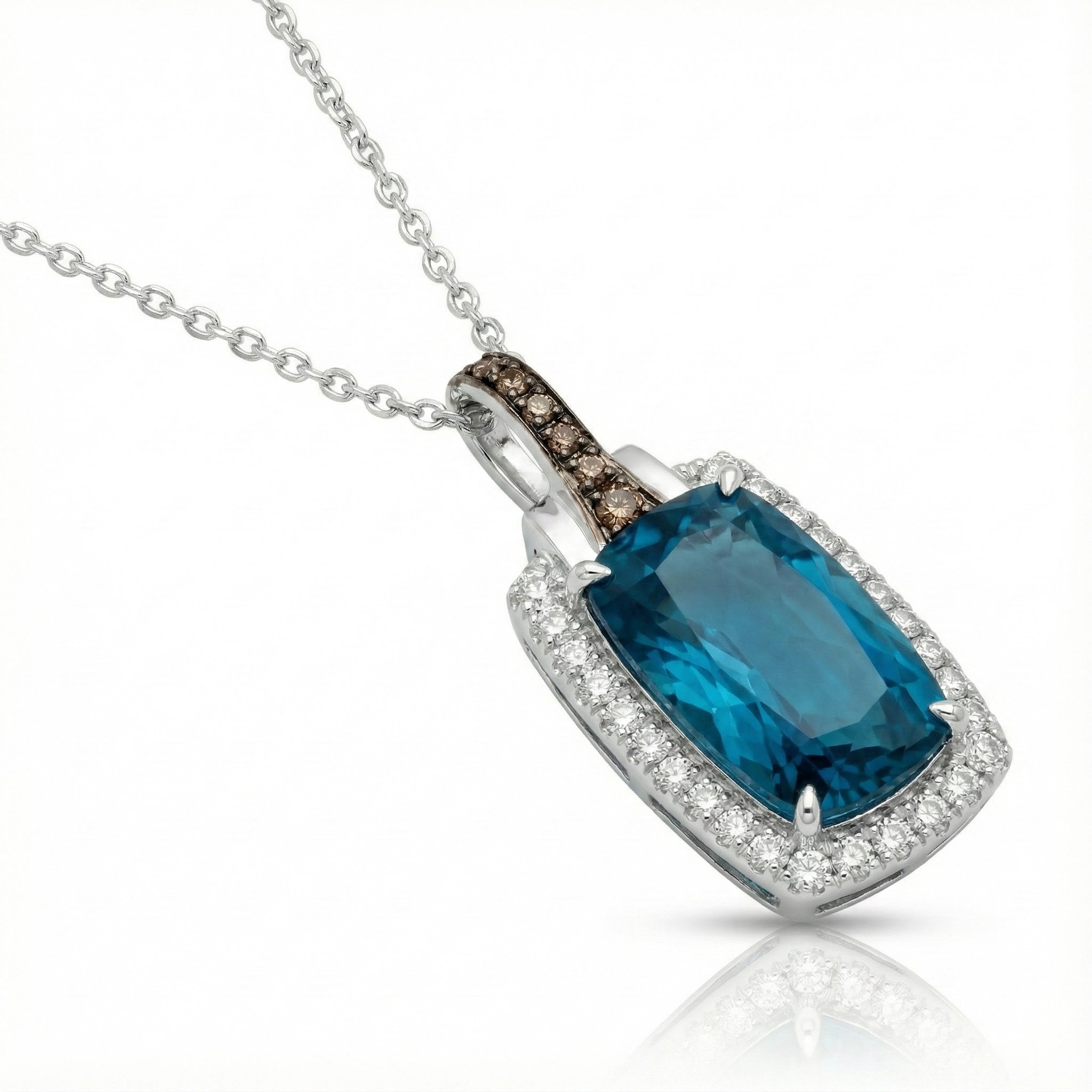 Le Vian® 14K Vanilla Gold® Deep Sea Blue Topaz™ & Diamond Pendant This stunning Le Vian® pendant highlights a vibrant 3 7/8 ct. Deep Sea Blue Topaz™, showcased in an elongated cushion shape that radiates bold ocean-blue brilliance