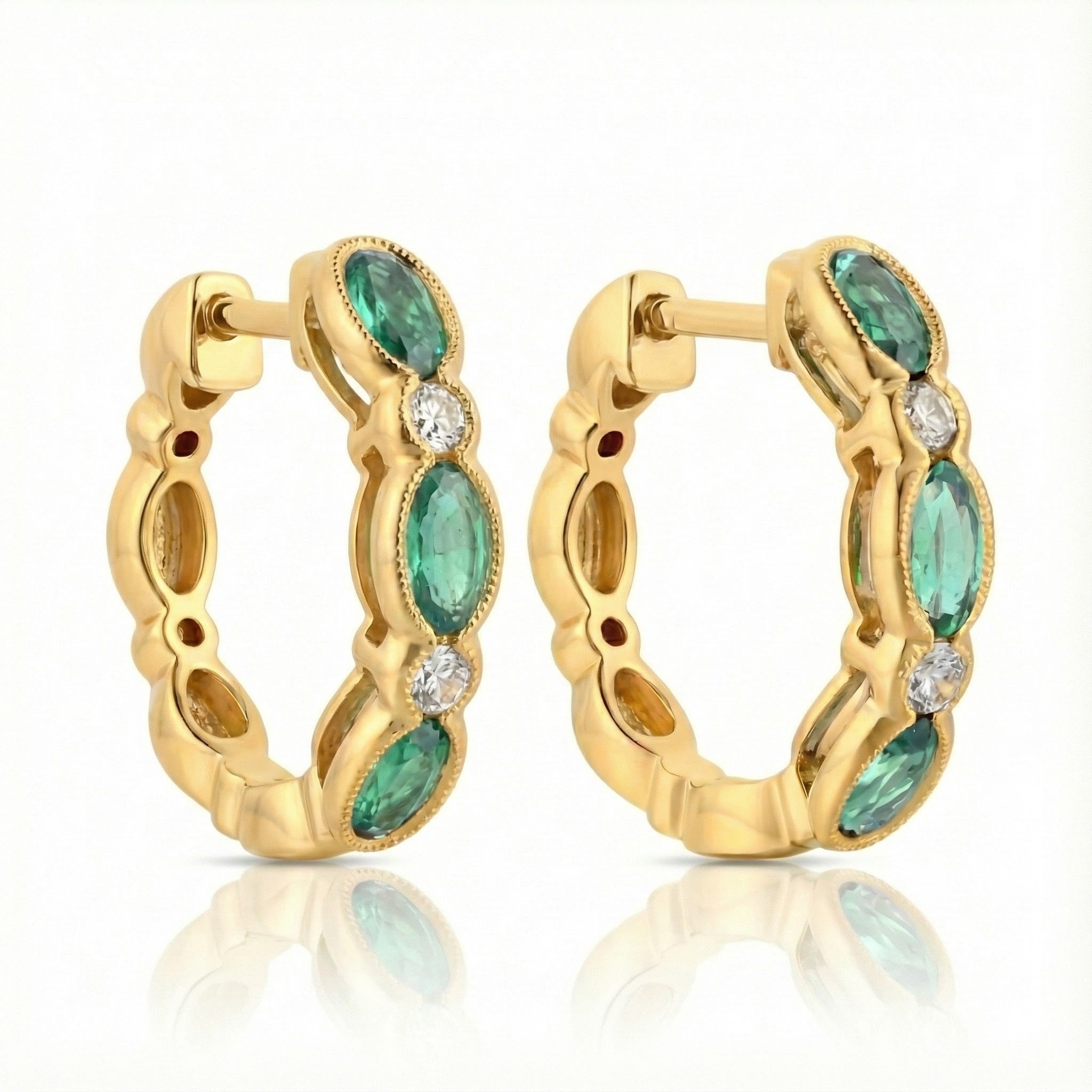 Emerald & Diamond Huggie Earrings | 14K Yellow Gold | 1.30 ctw | Oval Gemstone Hoops - Brownee Jewelers