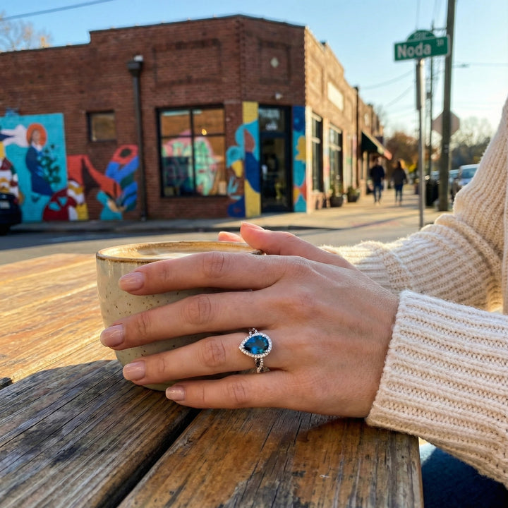 Le Vian® 14K Vanilla Gold® Deep Sea Blue Topaz™ & Diamond Halo Ring This breathtaking Le Vian® design showcases a bold 3.00 ct. Deep Sea Blue Topaz™ in a striking pear shape, radiating vivid ocean-blue brilliance