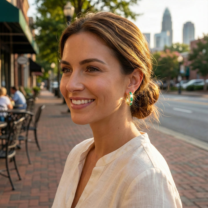 Emerald & Diamond Huggie Earrings | 14K Yellow Gold | 1.30 ctw | Oval Gemstone Hoops - Brownee Jewelers