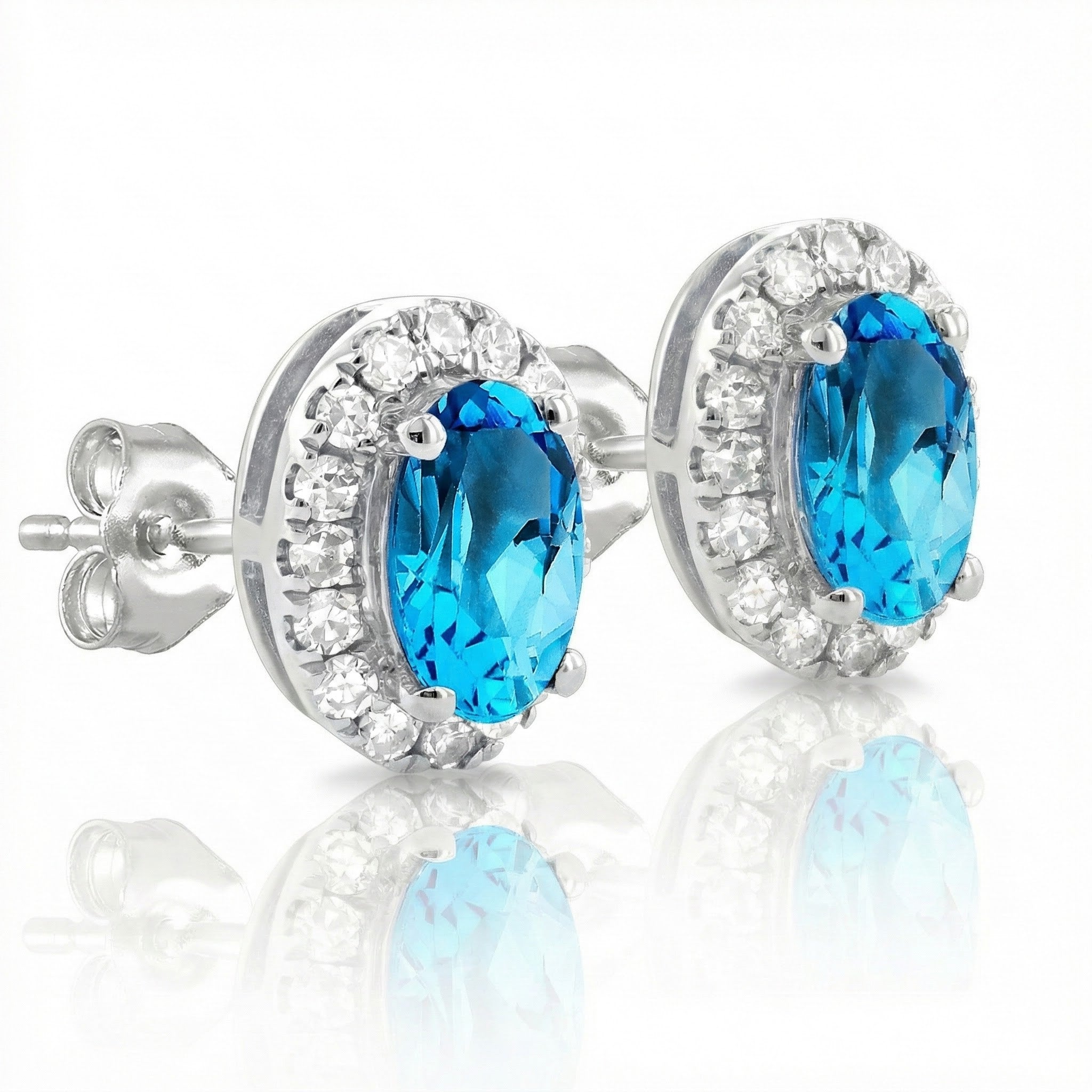 Oval Blue Topaz Diamond Halo Stud Earrings | 10K White Gold | 0.13 ctw | Friction Back - Brownee Jewelers