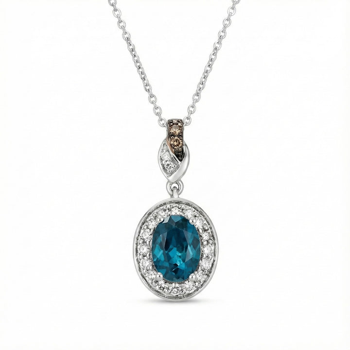 Le Vian® Deep Sea Blue Topaz™ & Diamond Pendant in 14K Vanilla Gold® Striking and sophisticated, this Le Vian® pendant showcases a vivid 1 1/4 cts. Deep Sea Blue Topaz™, framed by 1/4 ct. of soft, luminous Nude Diamonds™