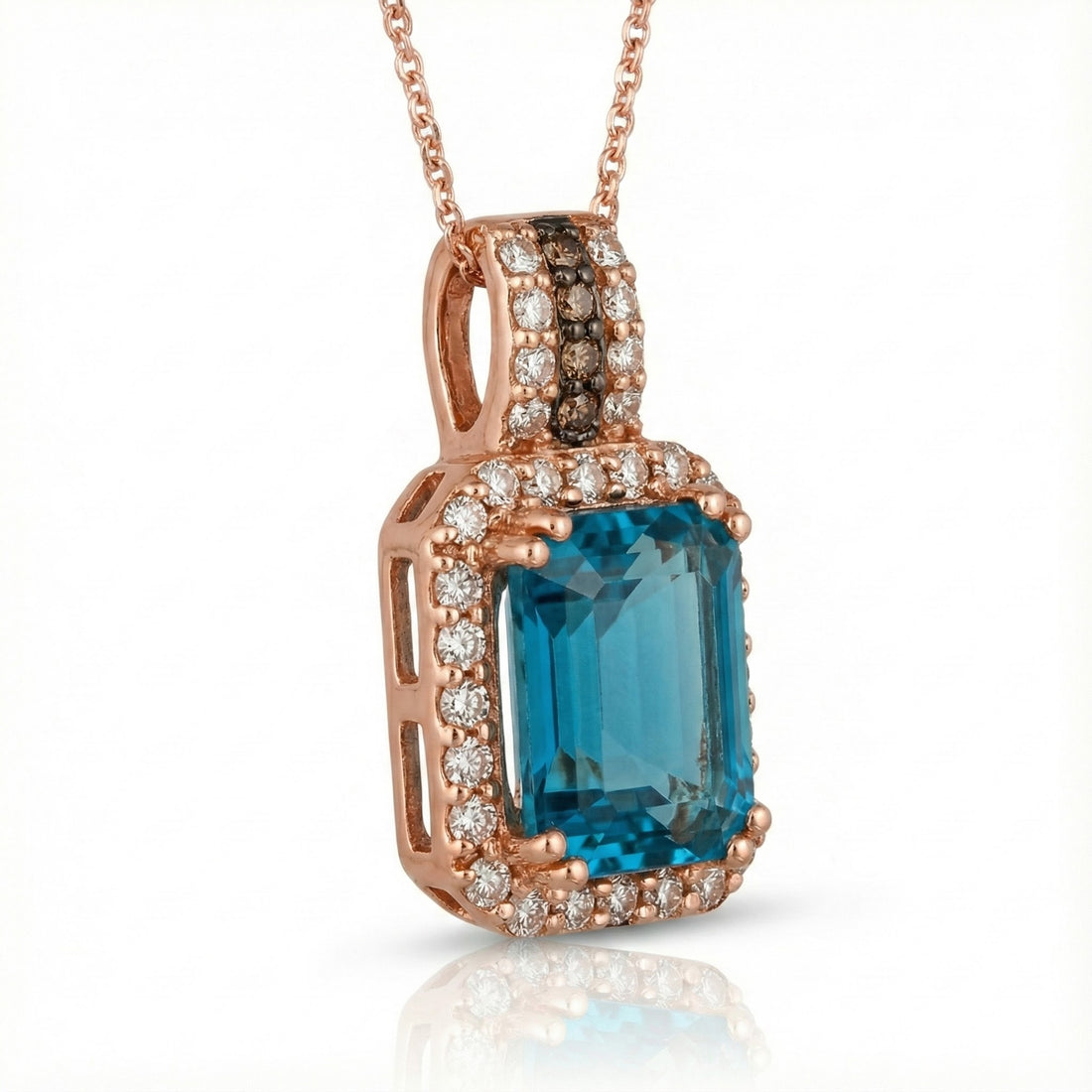 Le Vian® 14K Strawberry Gold® Deep Sea Blue Topaz™ & Nude Diamond™ Pendant (3.88ctw) Bold, vibrant, and luxuriously detailed—this Le Vian® pendant showcases a breathtaking 3 1/2 ct. Deep Sea Blue Topaz™ framed by 3/8 cts. of sparkling Nude Diamonds™