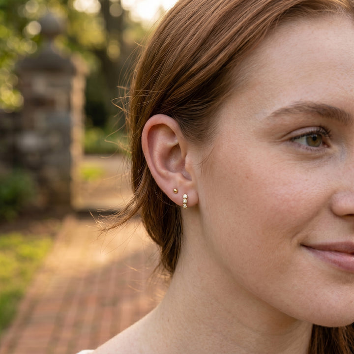 Round Lab-Grown Diamond Bezel Trio Huggie Earrings | 14K Yellow Gold | Earrings | 0.73 CTW Lab-Grown Diamonds | Bezel Set Trio Design | Huggie Hoops - Brownee Jewelers