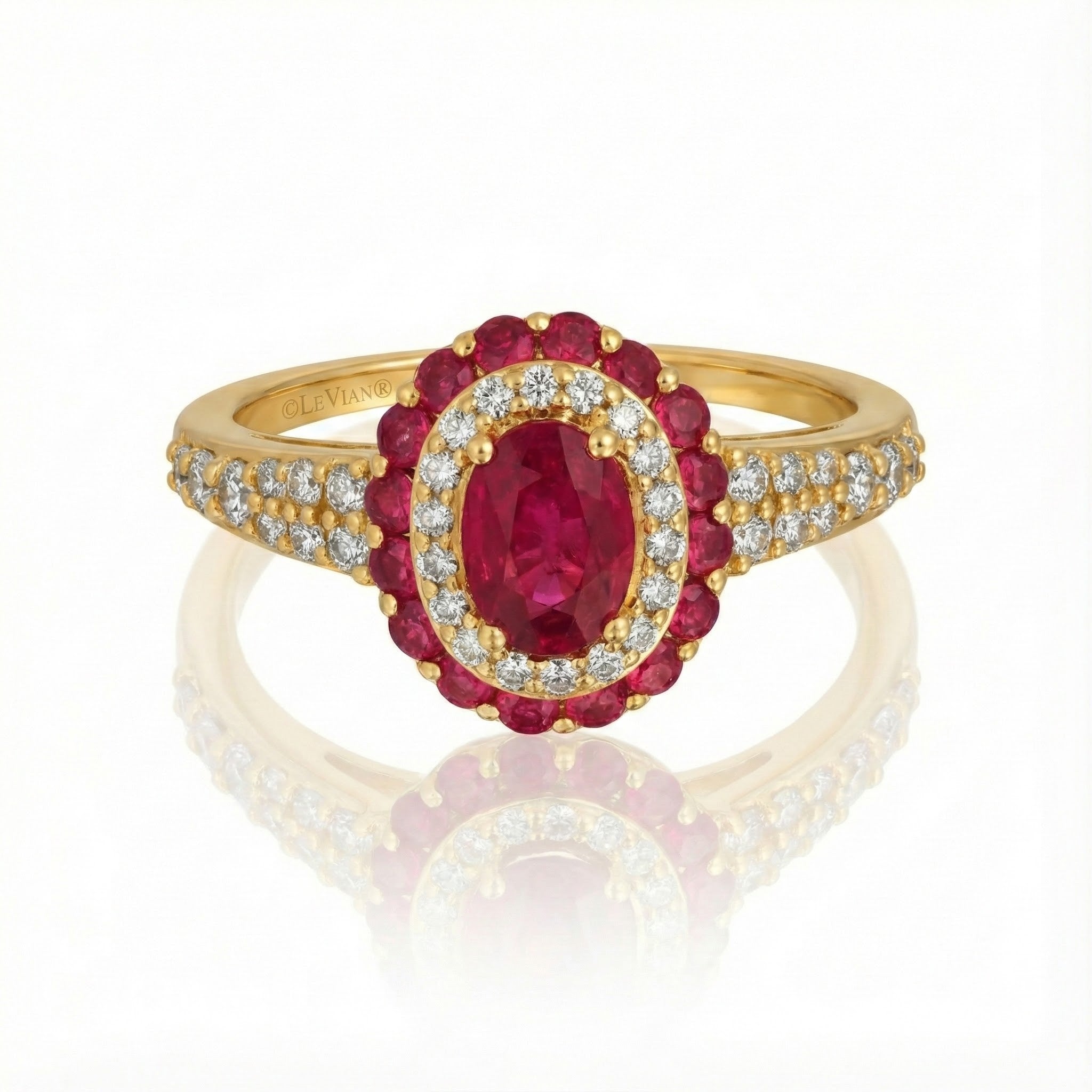 Le Vian® Passion Ruby™ & Vanilla Diamonds® Halo Ring – 14K Honey Gold™ Radiant and richly romantic, this stunning ring by Le Vian showcases a vivid oval Passion Ruby™ framed by a luminous double halo of sparkling Vanilla Diamonds®