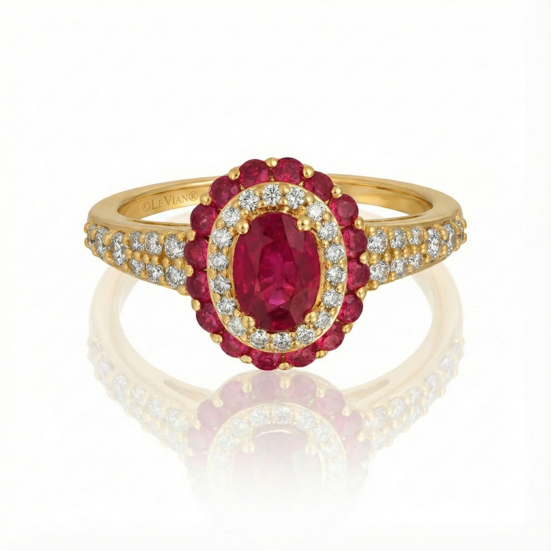 Le Vian® Passion Ruby™ & Vanilla Diamonds® Halo Ring – 14K Honey Gold™ Radiant and richly romantic, this stunning ring by Le Vian showcases a vivid oval Passion Ruby™ framed by a luminous double halo of sparkling Vanilla Diamonds®