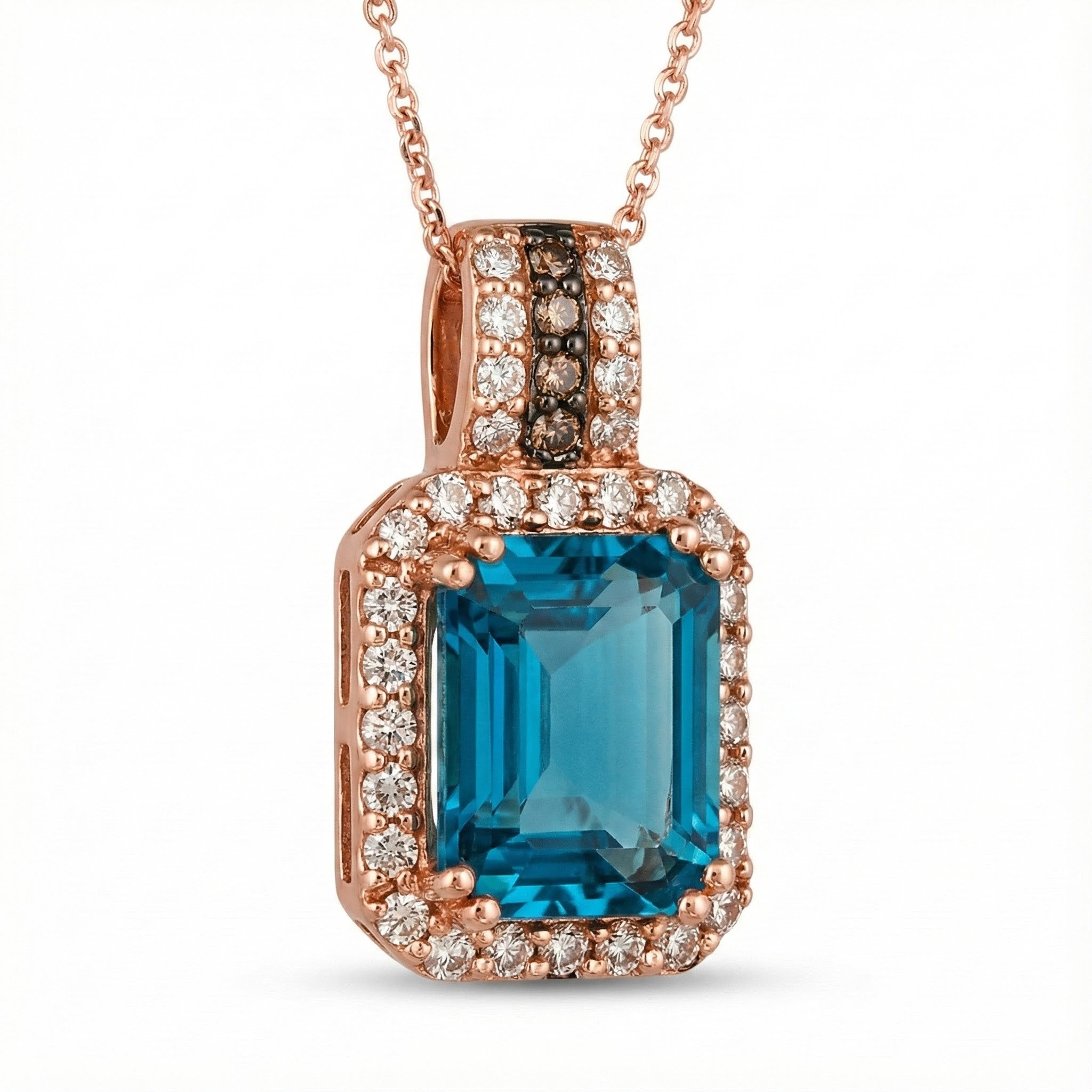 Le Vian® 14K Strawberry Gold® Deep Sea Blue Topaz™ & Nude Diamond™ Pendant (3.88ctw) Bold, vibrant, and luxuriously detailed—this Le Vian® pendant showcases a breathtaking 3 1/2 ct. Deep Sea Blue Topaz™ framed by 3/8 cts. of sparkling Nude Diamonds™