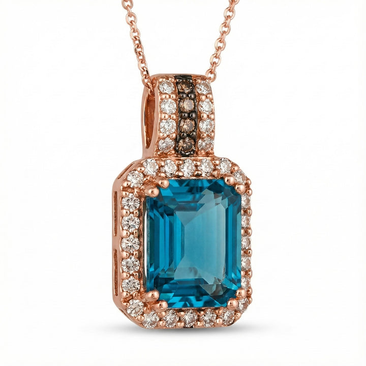 Le Vian® 14K Strawberry Gold® Deep Sea Blue Topaz™ & Nude Diamond™ Pendant (3.88ctw) Bold, vibrant, and luxuriously detailed—this Le Vian® pendant showcases a breathtaking 3 1/2 ct. Deep Sea Blue Topaz™ framed by 3/8 cts. of sparkling Nude Diamonds™
