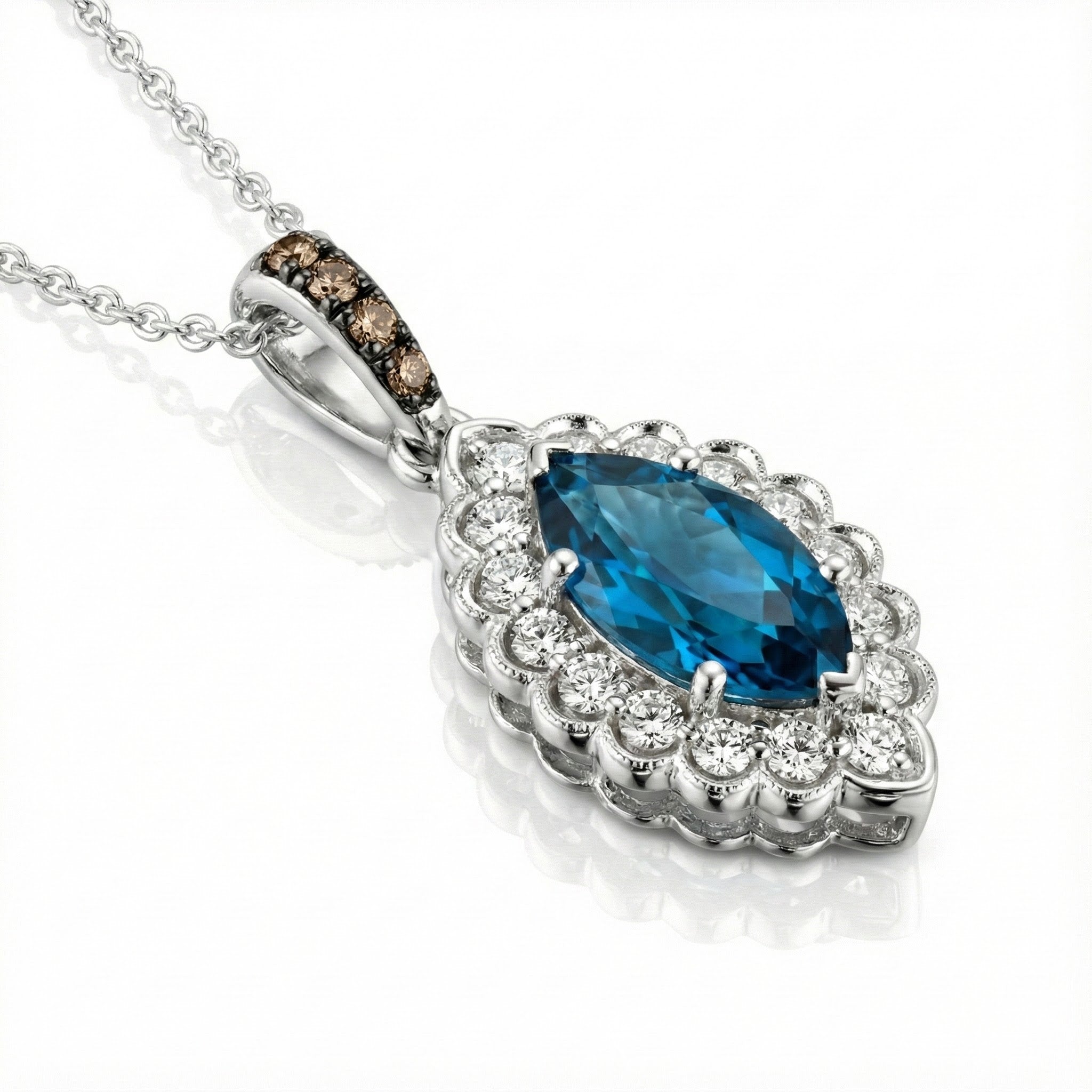 Le Vian® 14K Vanilla Gold® Deep Sea Blue Topaz™ & Nude/Chocolate Diamond® Pendant (1.25ctw) Elegant and eye-catching, this Le Vian® pendant showcases a brilliant 1 ct. Deep Sea Blue Topaz™ framed by 1/4 cts. of sparkling Nude Diamonds™ in a scalloped vintage-inspired halo