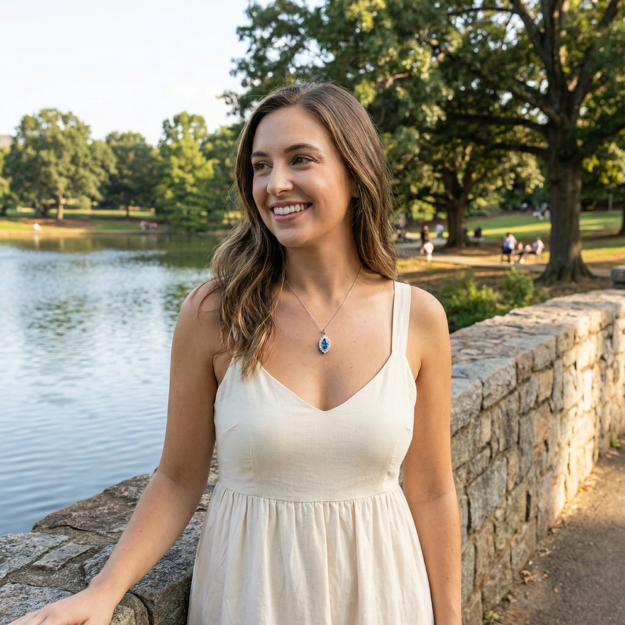 Le Vian® 14K Vanilla Gold® Deep Sea Blue Topaz™ & Nude/Chocolate Diamond® Pendant (1.25ctw) Elegant and eye-catching, this Le Vian® pendant showcases a brilliant 1 ct. Deep Sea Blue Topaz™ framed by 1/4 cts. of sparkling Nude Diamonds™ in a scalloped vintage-inspired halo