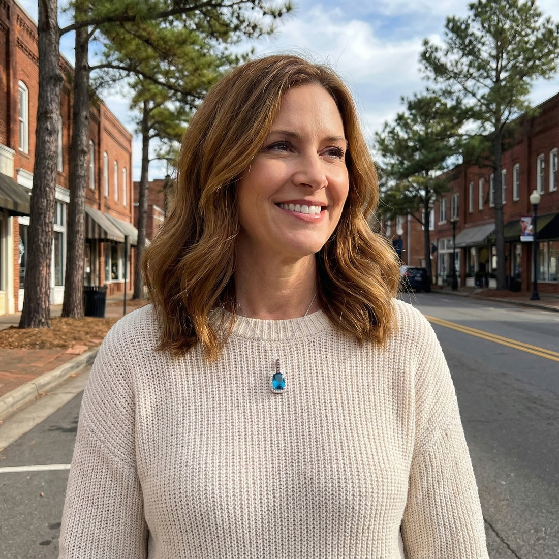 Le Vian® 14K Vanilla Gold® Deep Sea Blue Topaz™ & Diamond Pendant This stunning Le Vian® pendant highlights a vibrant 3 7/8 ct. Deep Sea Blue Topaz™, showcased in an elongated cushion shape that radiates bold ocean-blue brilliance