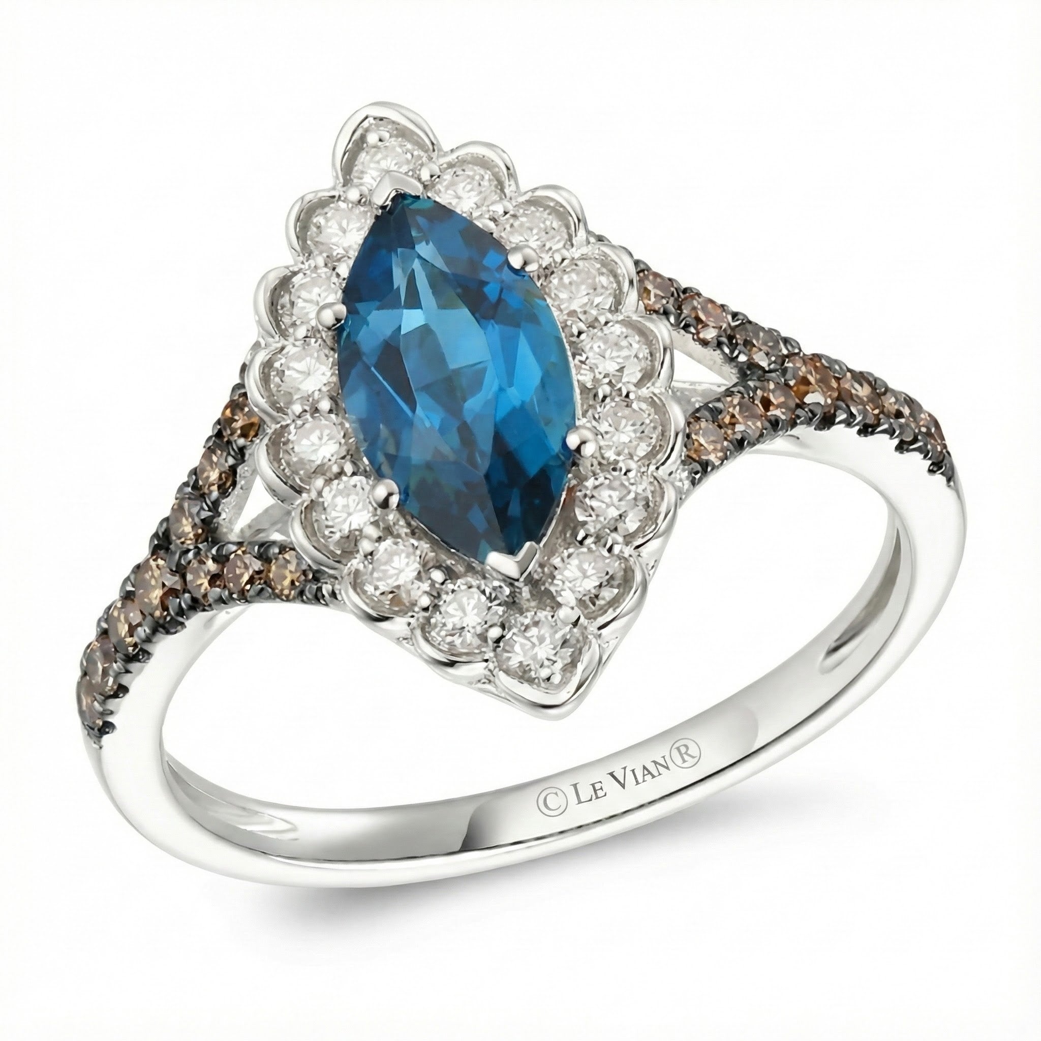 Le Vian® 14K Vanilla Gold® Deep Sea Blue Topaz™ & Chocolate/Nude Diamond® Ring (1.45ctw) Bold color meets elegant sparkle in this stunning Le Vian® ring featuring a vibrant 1 ct. Deep Sea Blue Topaz™ in an elongated marquise cut