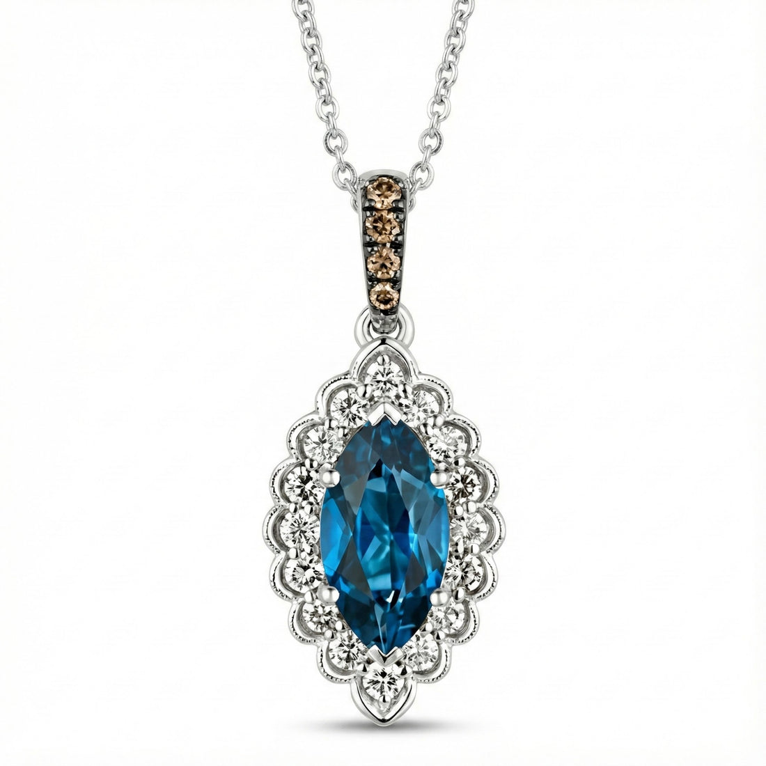 Le Vian® 14K Vanilla Gold® Deep Sea Blue Topaz™ & Nude/Chocolate Diamond® Pendant (1.25ctw) Elegant and eye-catching, this Le Vian® pendant showcases a brilliant 1 ct. Deep Sea Blue Topaz™ framed by 1/4 cts. of sparkling Nude Diamonds™ in a scalloped vintage-inspired halo