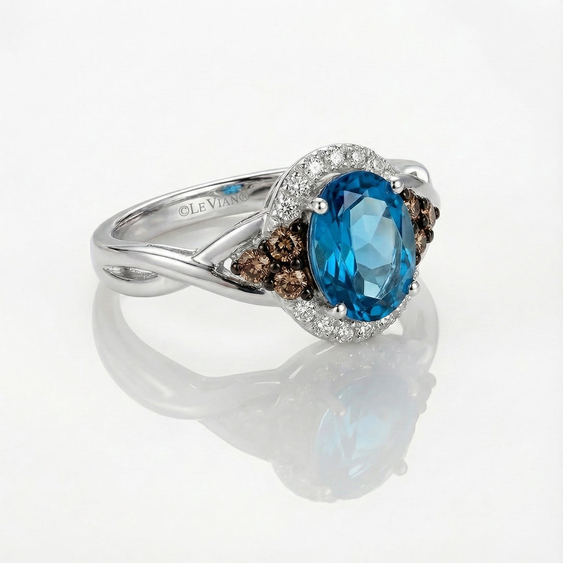 Le Vian® Chocolatier® Royal Blues Ring – 14K Two-Tone Gold Indulge in signature luxury with this stunning Le Vian Chocolatier® Royal Blues ring, showcasing a vivid oval blue topaz framed by rich Chocolate Diamonds®