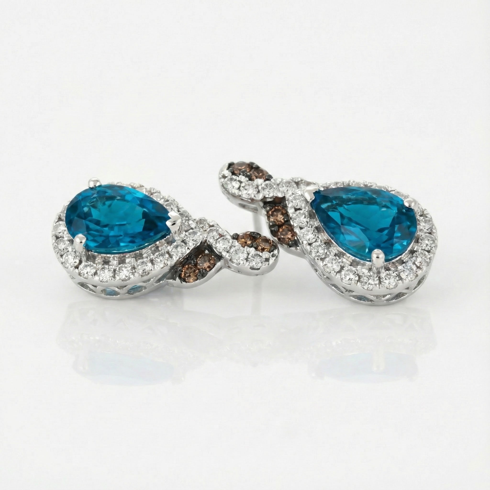 Le Vian® 14K Vanilla Gold® Earrings with Deep Sea Blue Topaz™, Chocolate Diamonds® & Nude Diamonds™ Radiant color and refined sparkle define these stunning Le Vian® drop earrings