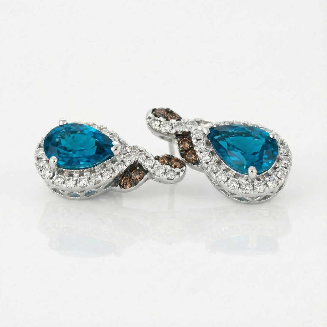 Le Vian® 14K Vanilla Gold® Earrings with Deep Sea Blue Topaz™, Chocolate Diamonds® & Nude Diamonds™ Radiant color and refined sparkle define these stunning Le Vian® drop earrings