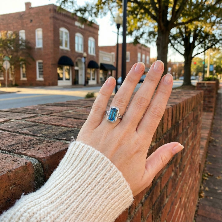 Le Vian® 14K Vanilla Gold® Deep Sea Blue Topaz™ & Chocolate/Nude Diamond® Ring (4.25ctw) Bold, dramatic, and brilliantly luxurious—this Le Vian® ring showcases an impressive 4 ct. Deep Sea Blue Topaz™ in a sleek elongated emerald cut