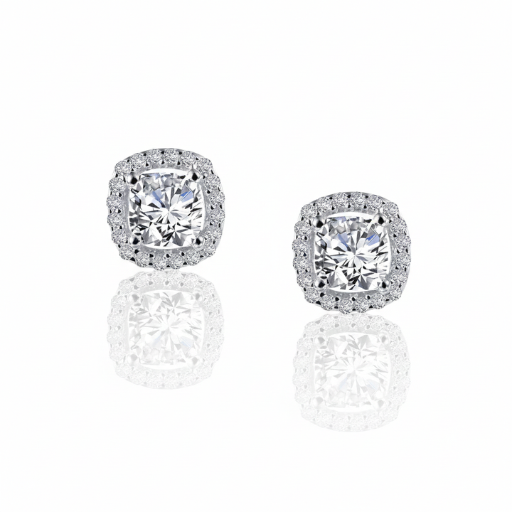 These 1.52 CTW Halo Stud Earrings feature Lafonn Lassaire simulated diamonds, showcasing a cushion-cut center framed by a halo of round stones for added brilliance and dimension.