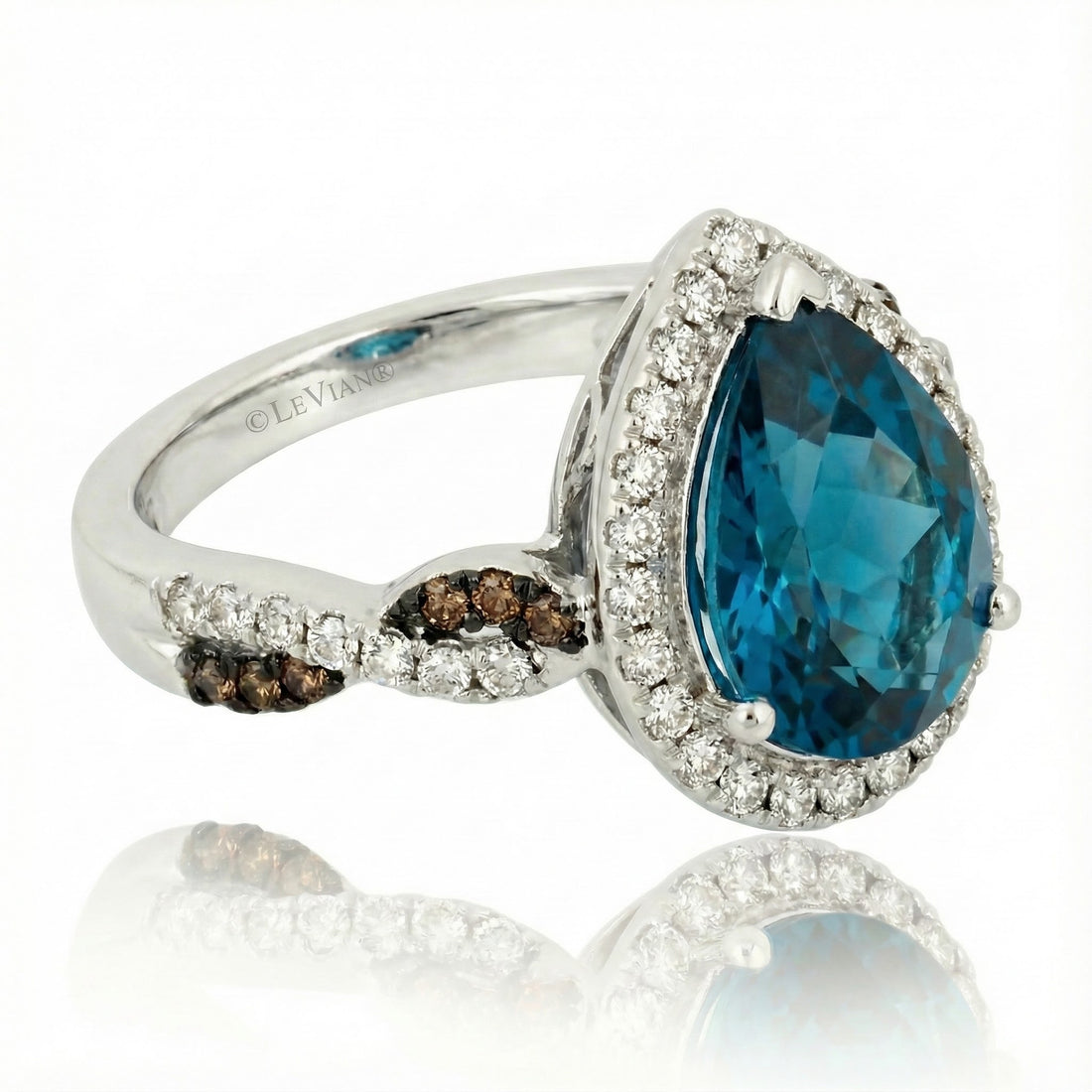 Le Vian® 14K Vanilla Gold® Deep Sea Blue Topaz™ & Diamond Halo Ring This breathtaking Le Vian® design showcases a bold 3.00 ct. Deep Sea Blue Topaz™ in a striking pear shape, radiating vivid ocean-blue brilliance