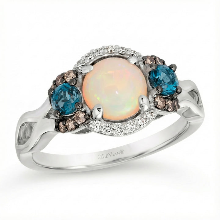 Le Vian Chocolatier® 14K Vanilla Gold® Ring with Neopolitan Opal®, Deep Sea Blue Topaz™, Chocolate Diamonds® & Vanilla Diamonds® This captivating Le Vian Chocolatier® ring pairs soft, glowing color with rich contrast in a beautifully balanced three-stone design