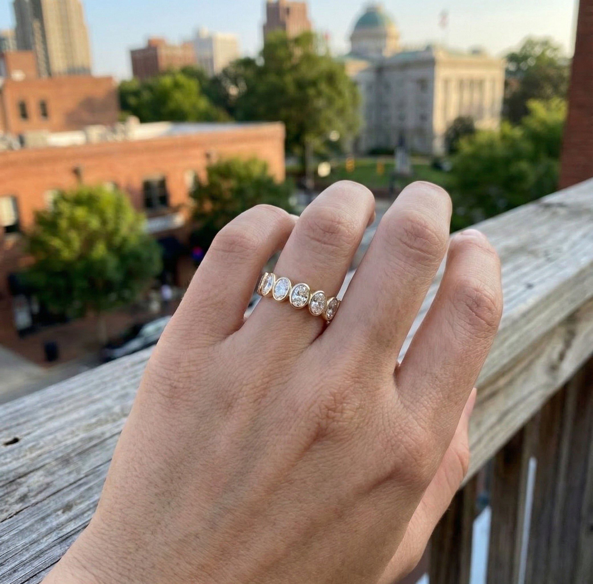 Oval Lab-Grown Diamond Band | 14K Yellow Gold | Bezel Set Wedding Ring | Seven Stone - Brownee Jewelers