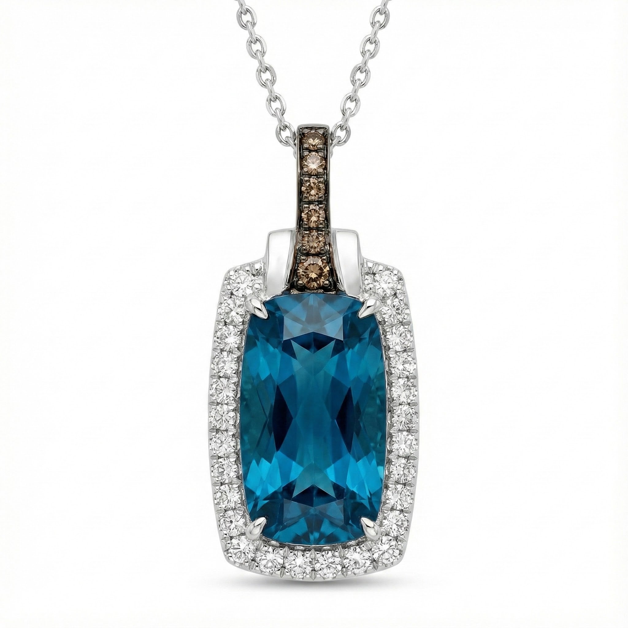 Le Vian® 14K Vanilla Gold® Deep Sea Blue Topaz™ & Diamond Pendant This stunning Le Vian® pendant highlights a vibrant 3 7/8 ct. Deep Sea Blue Topaz™, showcased in an elongated cushion shape that radiates bold ocean-blue brilliance