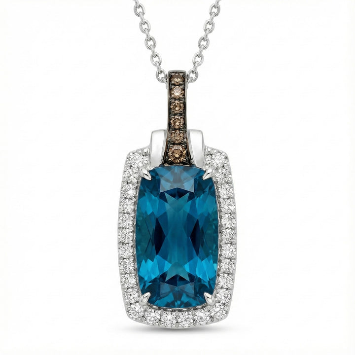 Le Vian® 14K Vanilla Gold® Deep Sea Blue Topaz™ & Diamond Pendant This stunning Le Vian® pendant highlights a vibrant 3 7/8 ct. Deep Sea Blue Topaz™, showcased in an elongated cushion shape that radiates bold ocean-blue brilliance