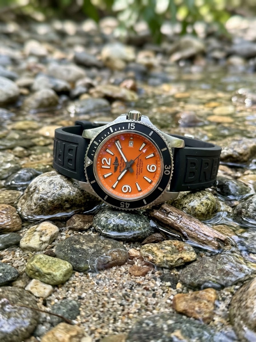 GTS BREITLING PRE OWNED BLK/ORANGE WATCH