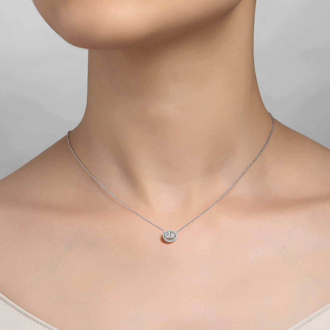 Timeless elegance. This halo necklace features Lafonn's signature Lassaire oval and round simulated diamonds in sterling silver bonded with platinum.