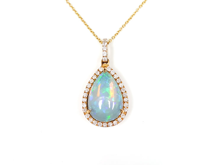 14K Yellow Gold 1.75ct Pear-Shape Opal & .29ct Diamond Pendant, A luminous 1.75ct pear-shaped opal radiates vibrant flashes of green, blue, and fiery orange, creating a mesmerizing play-of-color. - 1234751036 - Brownee Jewelers