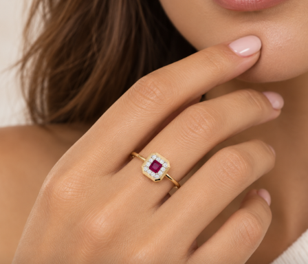 14 KARAT YELLOW GOLD SQUARE RUBY AND DIAMOND HALO RING 