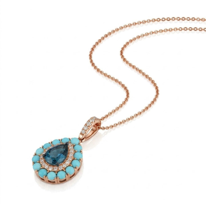 1 CARAT PEAR SHAPED DEEP BLUE TOPAZ PENDANT WITH .22 TOTAL CARAT WEIGHT ROUND DIAMOND AND .98 TOTAL CARAT WEIGHT ROUND TURQUOISE HALOS IN 14K ROSE GOLD