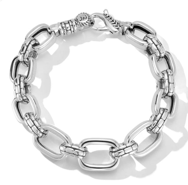 Our Sterling Silver Statement Link Bracelet features graduated rectangular links, which alternate with Box Chain element links for textural - Brownee Jewelers