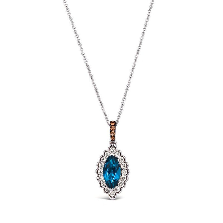 Le Vian® 14K Vanilla Gold® Deep Sea Blue Topaz™ & Nude/Chocolate Diamond® Pendant (1.25ctw) Elegant and eye-catching, this Le Vian® pendant showcases a brilliant 1 ct. Deep Sea Blue Topaz™ framed by 1/4 cts. of sparkling Nude Diamonds™ in a scalloped vintage-inspired halo