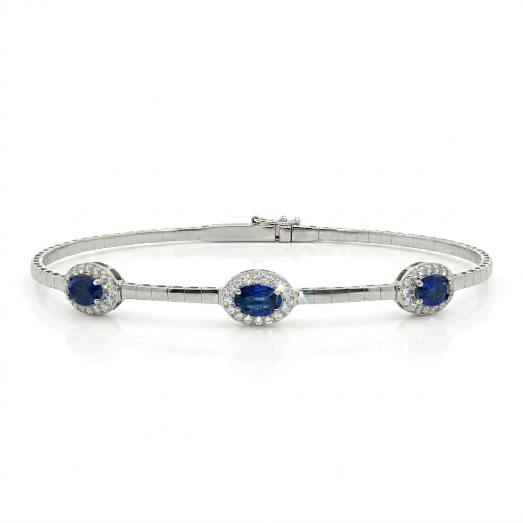 Blue Sapphire Halo Bangle | 14K White Gold | Oval Blue Sapphire & Diamond Bangle Bracelet | 1.48CT Sapphire & .25CT Diamond Accent - Brownee Jewelers