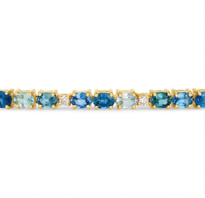 8.25 TOTAL CARAT WEIGHT MONTANA SAPPHIRES AND .40 TOTAL CARAT WEIGHT DIAMOND TENNIS BRACELET IN 14K YELLOW GOLD