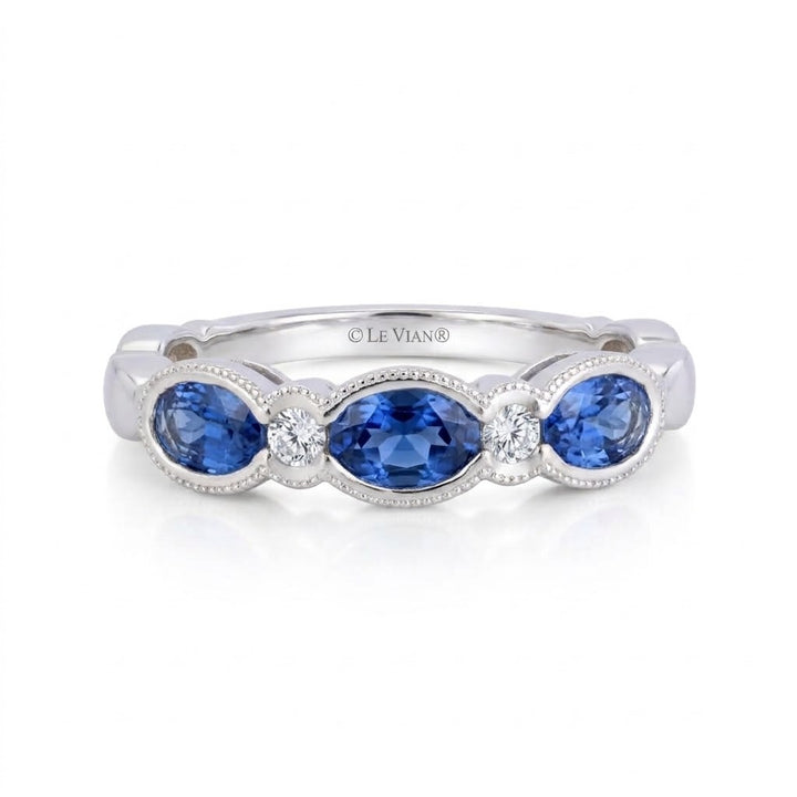 .81 TOTAL CARAT WEIGHT BLUE SAPPHIRE & .06 TOTAL CARAT WEIHGT DIAMOND BEZEL BAND IN 14K WHITE GOLD