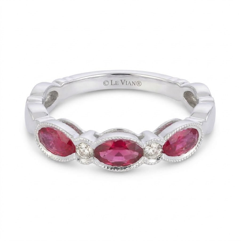 .70 TOTAL CARAT WEIGHT OVAL RUBY AND .06 TOTAL CARAT WEIGHT ROUND DIAMOND BEZEL BAND IN 14K WHITE GOLD