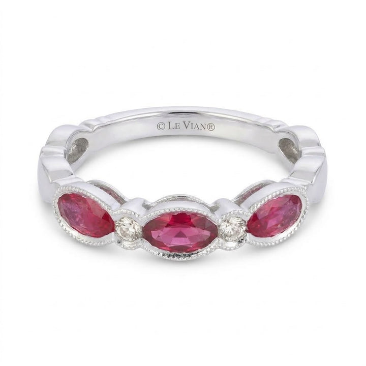 .70 TOTAL CARAT WEIGHT OVAL RUBY AND .06 TOTAL CARAT WEIGHT ROUND DIAMOND BEZEL BAND IN 14K WHITE GOLD