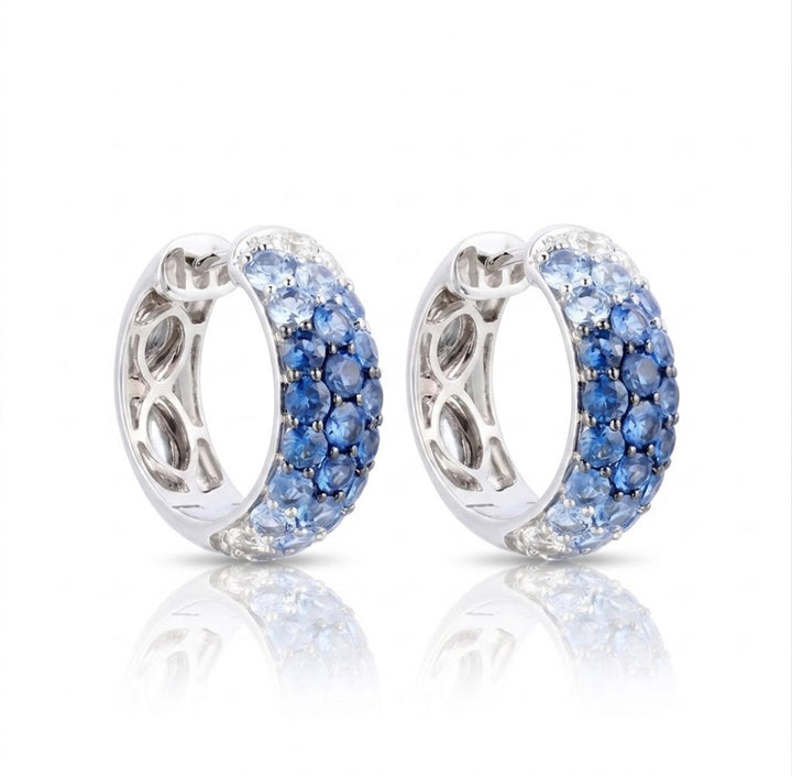 Le Vian® 14K Vanilla Gold® Denim Ombré® Sapphire & Vanilla Sapphire™ Hoop Earrings These striking Le Vian® Ombre® hoop earrings showcase a seamless gradient of 2 3/8 cts. Denim Ombré® Sapphires, transitioning from deep twilight blue to soft sky blue