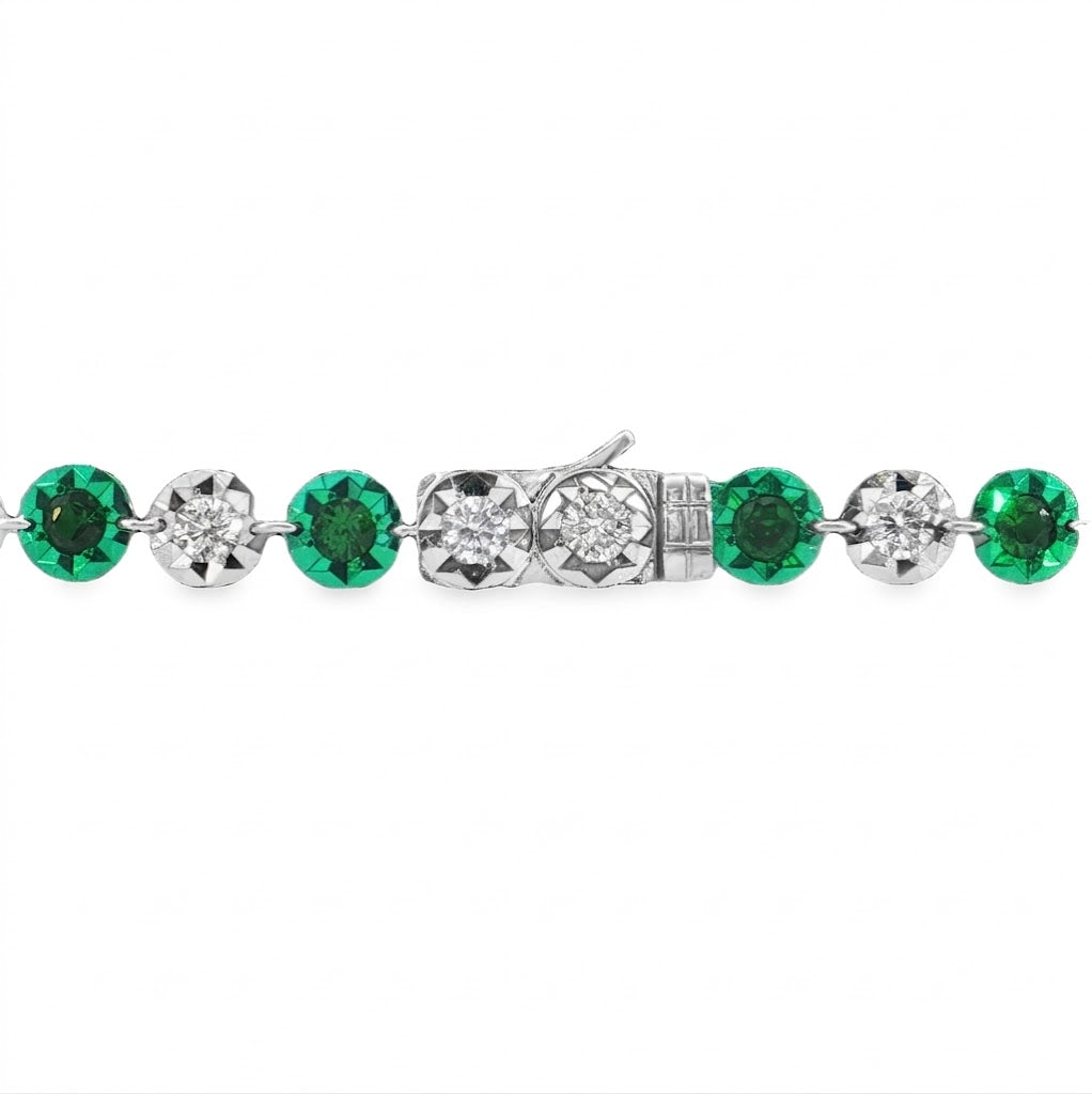 14 karat white and green gold diamond and garnet tennis bracelet 