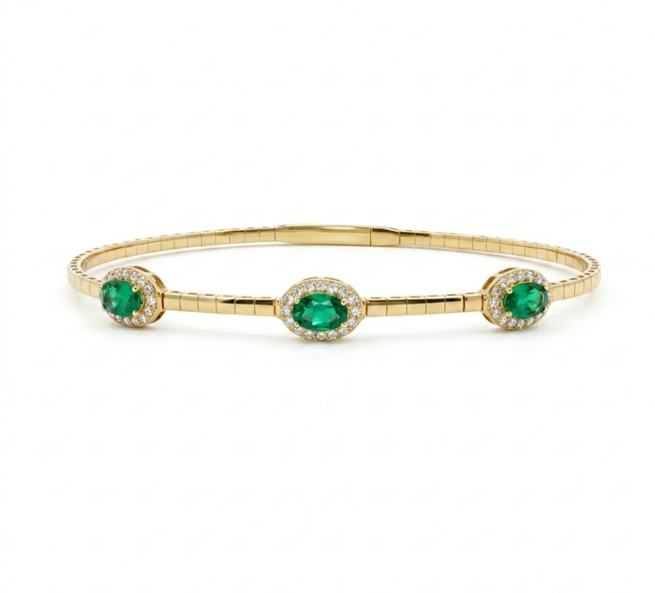 Emerald Halo Bangle | 14K Yellow Gold | Oval Emerald & Diamond Bangle Bracelet | 1.16CT Emerald & .255CT Diamond Accent - Brownee Jewelers