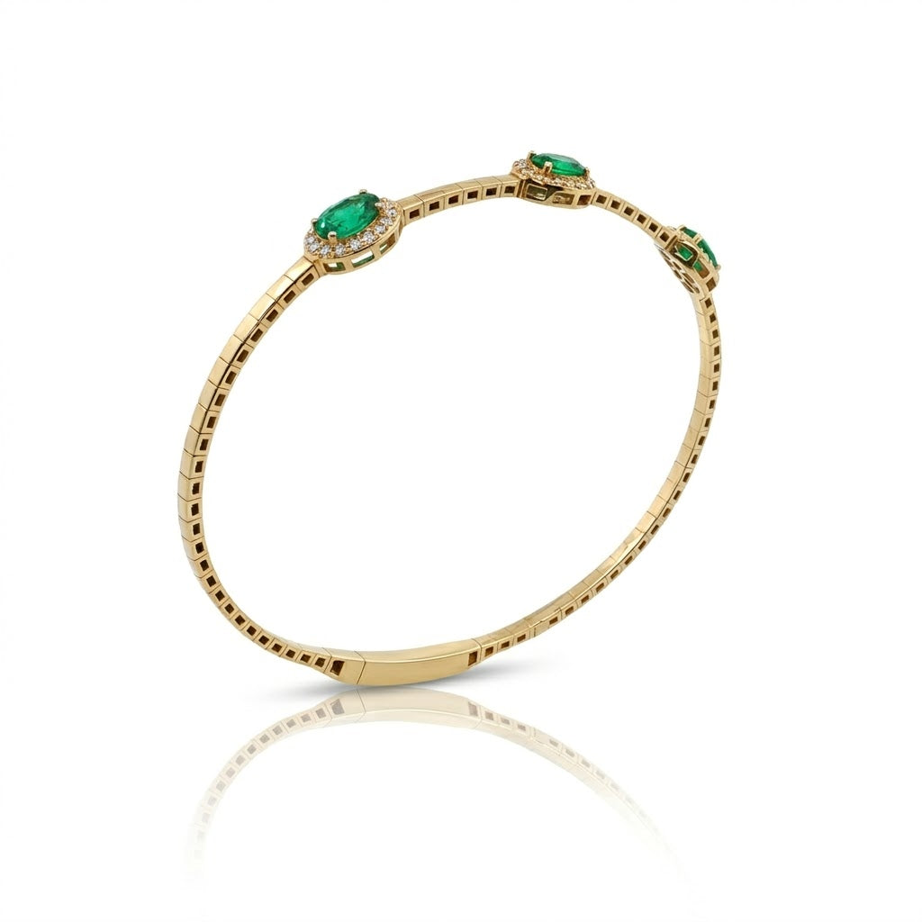 Emerald Halo Bangle | 14K Yellow Gold | Oval Emerald & Diamond Bangle Bracelet | 1.16CT Emerald & .255CT Diamond Accent - Brownee Jewelers