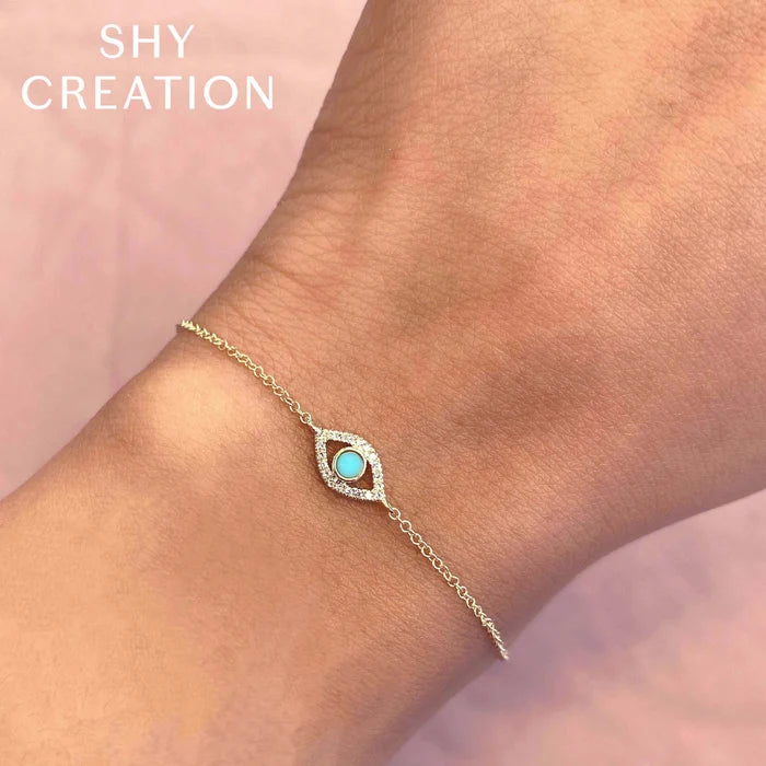 0.06 TOTAL CARAT WEIGHT DIAMOND & 0.07CT COMPOSITE TURQUOISE EYE BRACELET IN 14K YELLOW GOLD